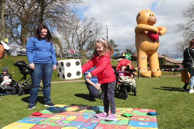 Imogen Martin playing snakes and ladders with Mayoress Jo Anna Martin.