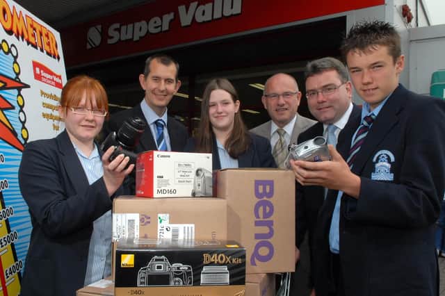 Pupils from Dromore High School along with some of the equipment which has been purchased with the help of the local Super Valu. Included are pupils Pamela Gibson, Gemma Clark, and Ryan Adair along with Stormont minister Edwin Poots, John Wilkinson, High School principal, and Russell Miller, Super Valu proprietor. BL25-123MC
