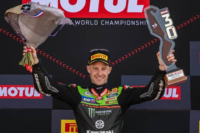 Jonathan Rea celebrates victory at Assen in the Netherlands, where he claimed a 100th victory for Kawasaki on Sunday.
