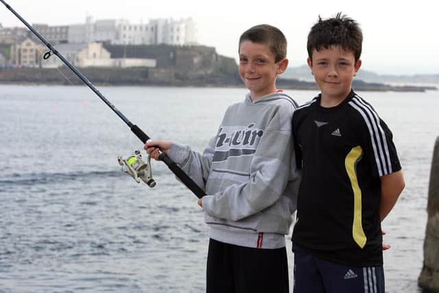 Jordan Bacon and Ross McDowell enjoy the fun at the Red Sails Festival fishing competition. CR31-213PL