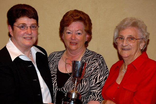Derryloran Parish Church Bowling Club members Doreen Hagan and Isobel Colvin winners of the Watson Cup for pairs in 2007 receive their prize from Janet Porteus.