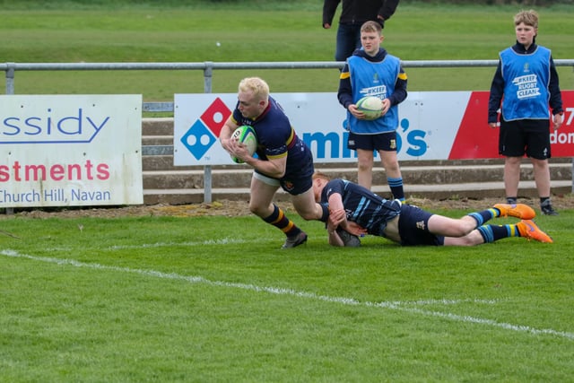 Conor Field on his way to scoring Bann's second try against Navan