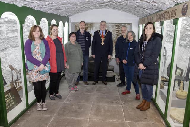 The Mayor of Causeway Coast and Glens Borough Council Councillor Richard Holmes pictured with Friends of Ballycastle Museum volunteers