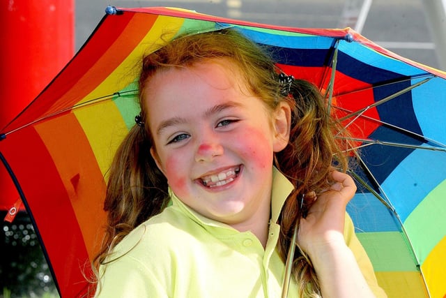 BROLLY GOOD SHOW...Cora Lagan smiles for the camera during the Red Sails Festival fancy dress parade in Portstewart. CR31-216PL