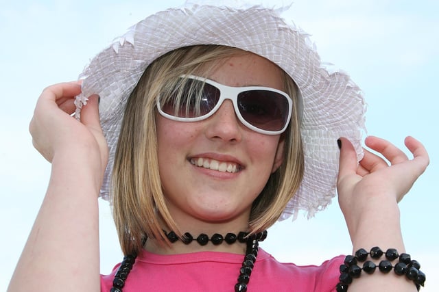 HAT AND SHADES...Amy Murray smiles for the camera during the Red Sails Festival fancy dress parade in Portstewart. CR31-220PL