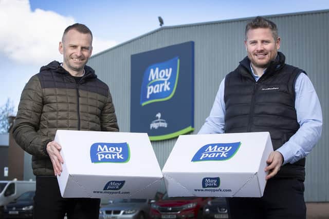 Will McDowell, Project Manager at Ballymena Foodbank, pictured receiving a donation from Moy Parks Aaron Whiteman.
