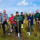 Mayor of Mid and East Antrim, Councillor William McCaughey, Paul Armstrong from the Woodland Trust and MEA Parks & Open Spaces staff planting the 58,000th tree.