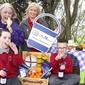 Samantha Coleman (Action Mental Health) and Laura Rea (EUROSPAR Rathcoole) alongside pupils Jessica Graham and Jayden Young.