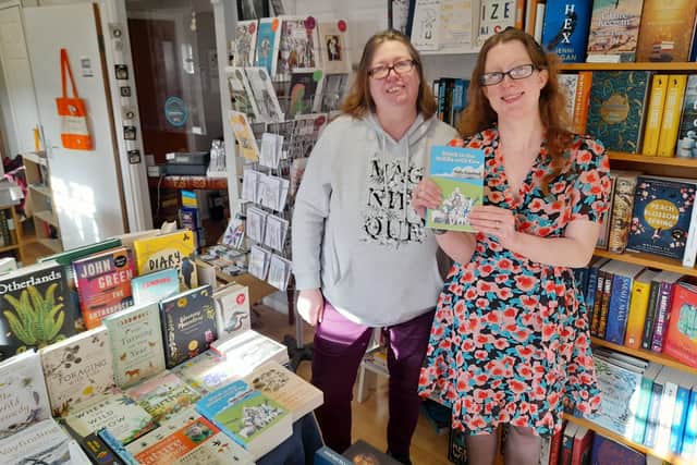 Holly with Jo Zebedee (left), owner of The Secret Bookshelf in Carrickfergus.