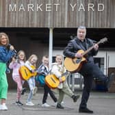 Left to right: Daisie Conway, Evie Addis, Ella Johnston, Lewis Rennie, Ruby Mills and Johnny Hero warming up for the festival.