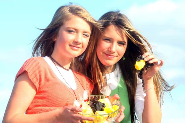 Sisters Tori and Ellie Reilly from Capecastle near Ballycastle try out some traditional yellowman and dulse as they get ready for the Oul Lammas fair on Monday and Tuesday.BM35-207JC