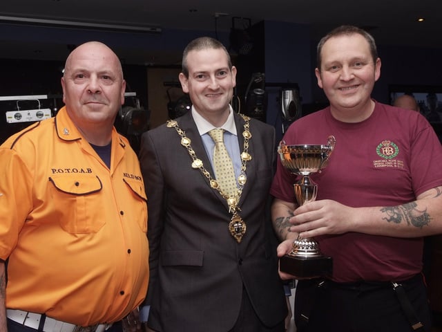 The Mayor, Councillor Martin Reilly, pictured presenting the Best Drum Corps Cup to Alistair Thompson, of the Churchill Flute Band, at the presentation ceremony held in Rochesters for the Marching Bands Competition which took place in Ebrington Square. Included is Geoff Cruickshank, left, of the Pride of the Orange & Blue Auld Boys, organisers of the event. INLS4113-104KM