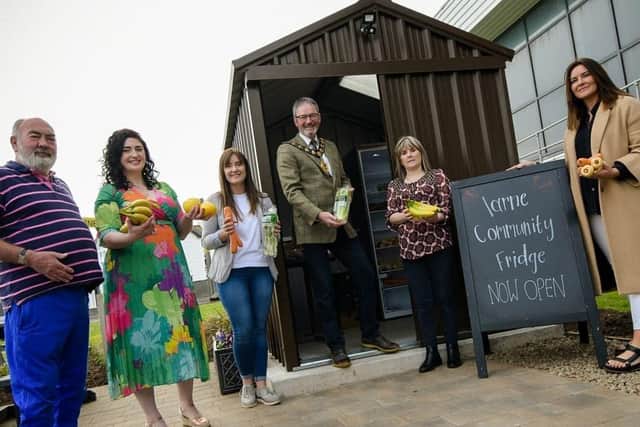 The Mayor, Councillor William McCaughey, with funder and volunteer representatives at the opening of Larne Community Fridge.