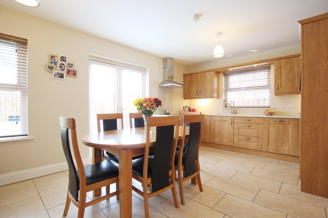 The open plan kitchen and dining area has an excellent range of units and integrated appliances.