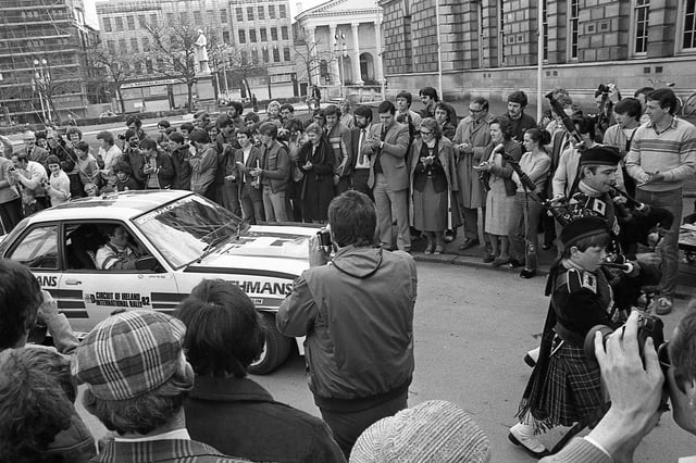 Pipe Major Brian Rae and his son Alfie lead in Circuit of Ireland winner Jimmy McRae’s car to the Belfast City Hall finish in April 1982. Picture: News Letter archives