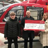 The Nelson family present a cheque to the Northern Ireland Air Ambulance