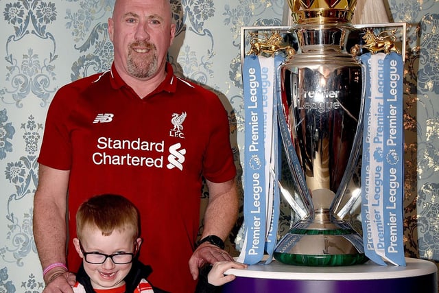 Michael Grimley and grandson Mark (5) posing happily with the EPL Trophy. INPT18-203.