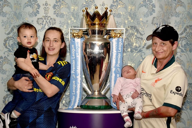 Posing with the EPL Trophy are from left, Philip Lo (19 months), Moira Lo, Aaliyah LO (1 month) and Ann Knox. INPT18-208.