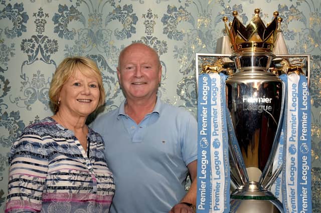 Bernie and Charlie McKeever of McKeever's Bar posing with the EPL Trophy when it visited their pub last Wednesday. INPT18-216.