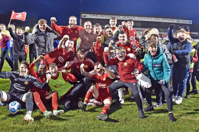 We're Staying Up...Portadown players and some fans celebrate their victory in the playoff. INPT19-203.