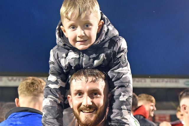 Portadown player, Jack Smith pictured with his son, brodie, after the Portadown victory in the Premiership playoff. INPT19-204.