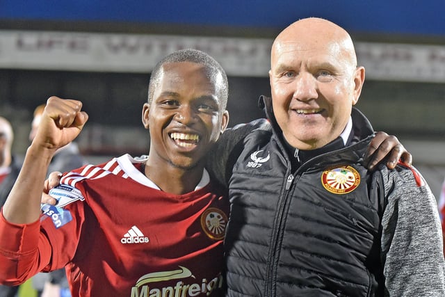 Portadown manager, Paul Doolin, celebrates with Katlego Mashigo after the 1-0 victory over local rivals, Annagh United. INPT19-207.