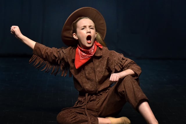 Alice Mackle as 'Calamity Jane' singing and dancing to the famous song, 'Windy City'. INPT18-240.