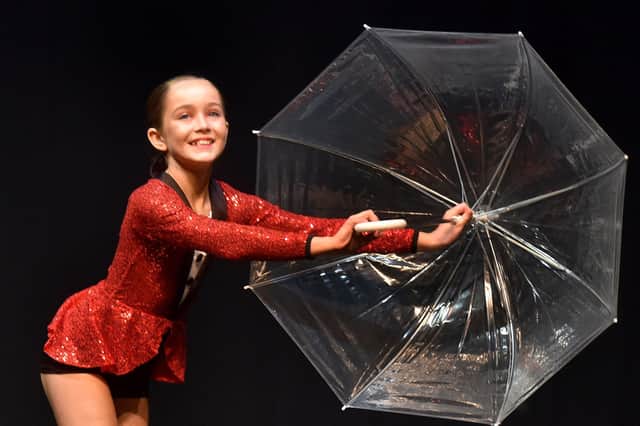 Grace King is Singin' In The Rain during her Novice Modern Solo performance. INPT18-233.