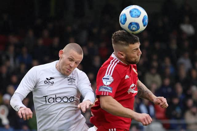 Annagh United's Scott McCullough (left) competing with Adam Salley at Shamrock Park on a night Portadown secured Premiership status with a 4-2 aggregate play-off win. Pic by Pacemaker