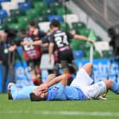 Ballymena United players are dejected after Johnny McMurray’s winner for Crusaders