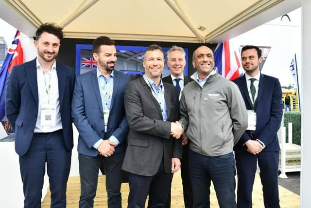 L:R - Head of Wrightbus International Nathan Hodge, Volgren COO Yuri Tessari, Volgren CEO Thiago Deiro, Ian Paisley Jr MP for North Antrim, Wrightbus CEO Buta Atwal, Department of International Trade's Deputy Director of Northern Ireland James Toolan