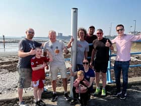 Left to Right: Gareth Rowan, Gary Davison, Judith McLaughlin, Vicki McAneney, Matt McAneney, Andy Smyth and Councillor Peter Johnston at the new Carrick seafront shower.