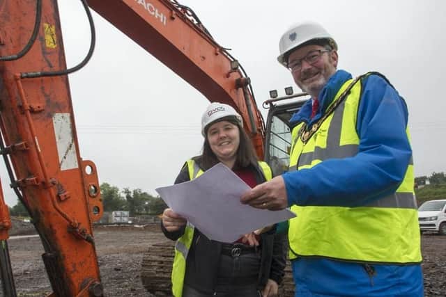 The Mayor of Mid and East Antrim, Cllr William McCaughey, and Jessica Stronge, site manager, from CIVC,  looking over the plans at Sullatober recycling centre when the scheme began.