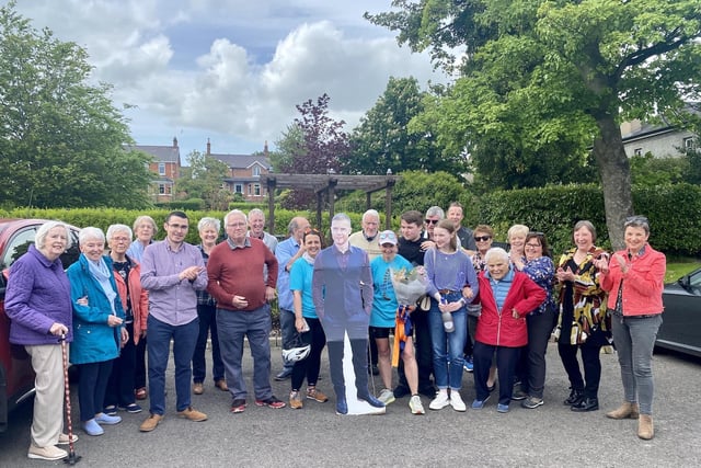The gang’s all here: Abbeyfield & Wesley colleagues, Wesley Court residents, family and friends - and a Gary Barlow cut out, specially for Julie who is a massive fan  -  all came together to celebrate Julie’s success in completing her 41 mile challenge run.