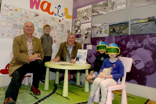 Creating their road racing tile designs are Joshua and Evelyn Austin (far right) and Bobby Acheson (left). Accompanying them are Robert Dixon (far left) and the Mayor of Causeway Coast and Glens Borough Council, Councillor Richard Holmes (centre)