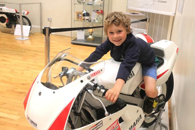 Young Joshua Austin enjoying the new ‘The Race and the Places’ exhibition at Ballymoney museum. Open until August 27th 2022, it features a selection of racing bikes, photographs, trophies, memorabilia and a timeline covering the past 90 years of racing