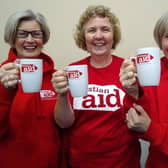 Coleraine supporters of Christian Aid celebrate the success of women in Zimbabwe who have overcome drought to provide for their families by growing drought-tolerant hibiscus tea. L-R, Irene Kinghan, Pauline Connor and Ann Kirkland are members of Terrace Row Presbyterian Church in Coleraine. Credit: Helen Newell/Christian Aid