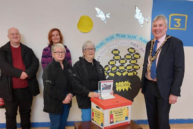 The Mayor of Causeway Coast and Glens Borough Council, Councillor Richard Holmes (far right), recently visited Rasharkin Community Centre to hear more about the ‘Sharkin Plan-It’ project