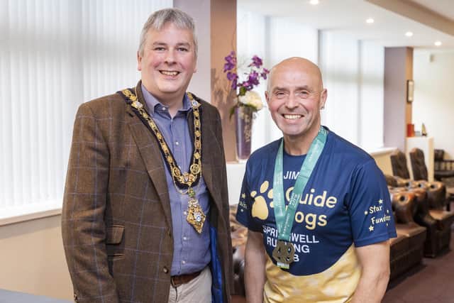 Garvagh man Jim Bradley (right) is currently completing five marathons in five months to help raise much needed funds for Guide Dogs NI. Jim was recently welcomed to Cloonavin for a special reception by the Mayor of Causeway Coast and Glens Borough Council, Councillor Richard Holmes