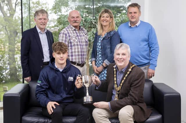 Sailing star Tom Coulter (front-left) pictured the Mayor of Causeway Coast and Glens Borough Council, Councillor Richard Holmes during a recent reception held in his honour in Cloonavin. Also pictured, back row (left-right) are: Alderman Mark Fielding, Ivor Neill, Portrush Yacht Club Principal and Tom’s parents Juliet and Peter