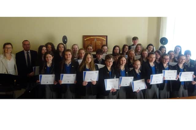 Members of Dominican College's junior choir with Miss Minihan and Mr Lynch