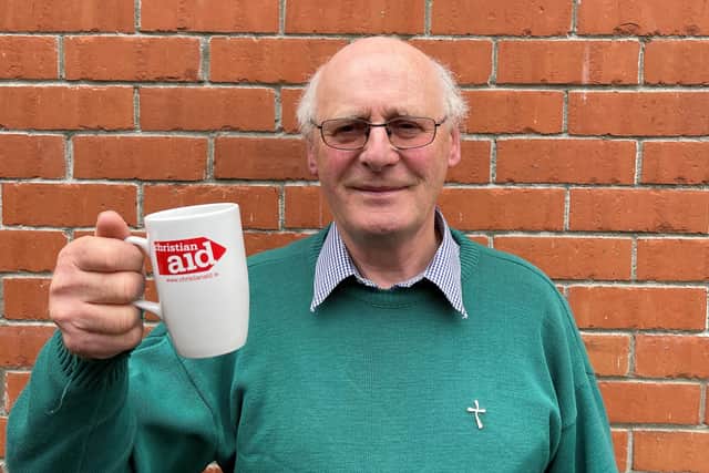 Canon George Irwin, retired rector of Ballymacash, raised a cup of tea to say ‘cheers’ to women farmers in Zimbabwe, supported by Christian Aid, who are making a living despite poor rainfall, by growing drought-resistant herbal tea. Credit: David Rochester