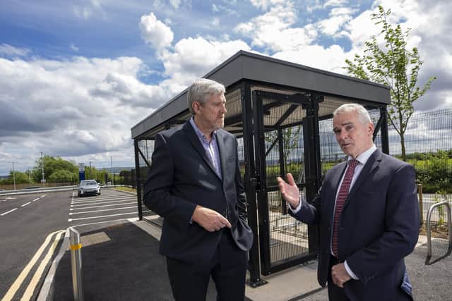 Infrastructure Minister john O’Dowd and Chris Conway, chief executive of Translink, view the new 212- space facility  including the secure cycle storage on site.
