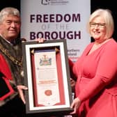 Heather Weir, Chief Executive of the NI Hospice accepts the Freedom of the Borough award on behalf of the charity from Mayor of Antrim and Newtownabbey Cllr Billy Webb.