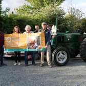 Members of the Dromara Vintage and Classic Club with Cancer Fund For Children representative Jordana Stoney-Wilson (from left) Peter McGrady, Gerard McGrillen, Griff Morrow, James Fegan, Brian McGrillen and Davy Thompson at last weeks launch of the charity tractor run.