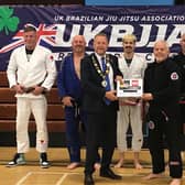 Cllr Stephen Ross and Robert Cullinan pictured alongside martial arts practitioners.