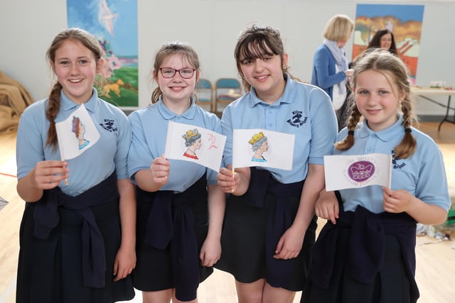 Pupils show off their creative flag designs made at the Museums Service workshop