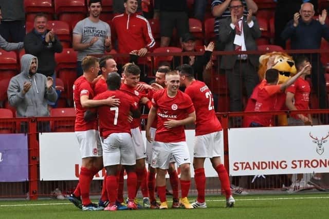 Larne players congratulating Ronan Hale following his goal against Bala Town in the UEFA Europa Conference League first round qualifier at Inver Park in July 2021. Pic by Pacemaker.