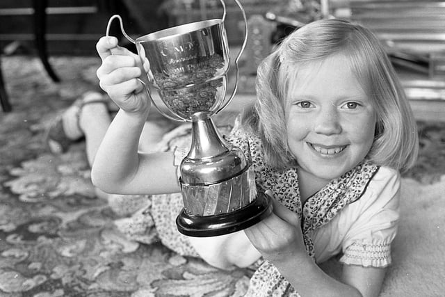 Pictured in May 1982 is eight-year-old Barbara Draffin from Bishopscourt Farm, Dromore, Co Down, who defeated 37 boys and girls to win the Naomi Pepper Cup for solo singing at the Carrickfergus Music Festival. Picture: News Letter archives