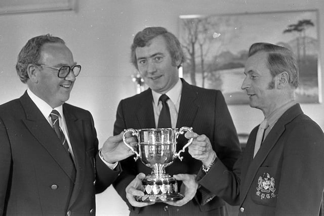 Mr Pat O’Kane, director of Scottish and Newcastle Breweries (Ireland) Limited, pictured with Mr Joe McCarthy, left, captain of the Dublin Licensed Vintners, and Mr Bill McSorley, captain of the Belfast Vintners at Malone Golf Club, Belfast, in May 1982, where the annual North-South golf match was played. Picture: News Letter archives